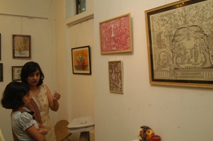 Visitors looking at the artworks at Artfest 09, Indiaart Gallery